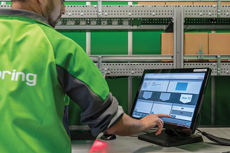 In automated DCs, WES is often used to manage picking workflows, as with this AutoStore system running on Swisslog’s software.